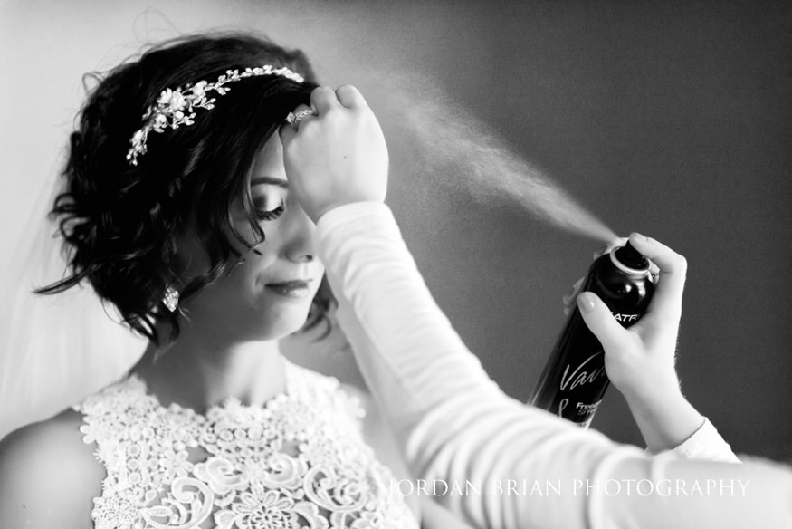 Bride getting ready before Crystal Point Yacht Club wedding.